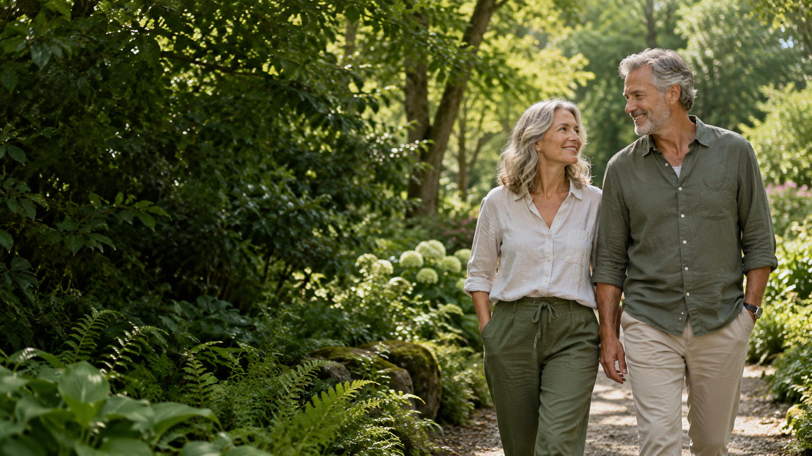 A couple enjoying a relaxed walk through a green garden